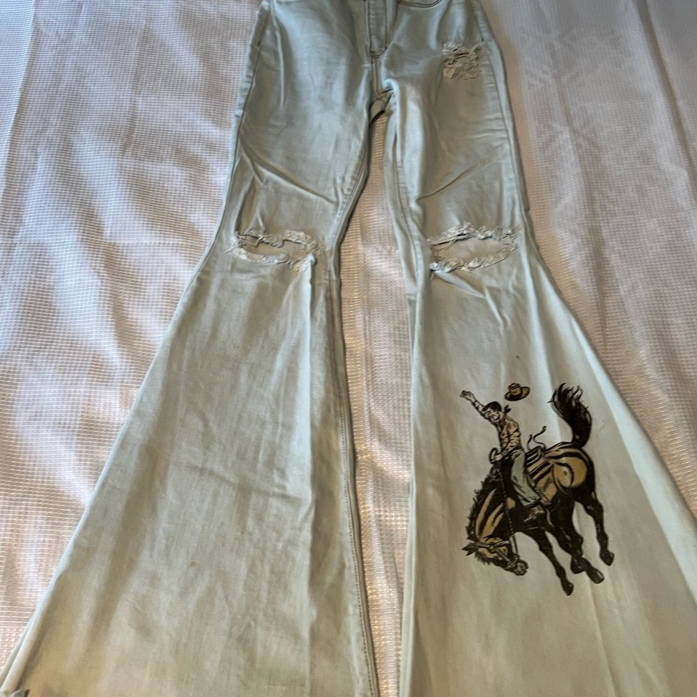 Vibrant Light Blue Flared Jeans with Cowboy Design